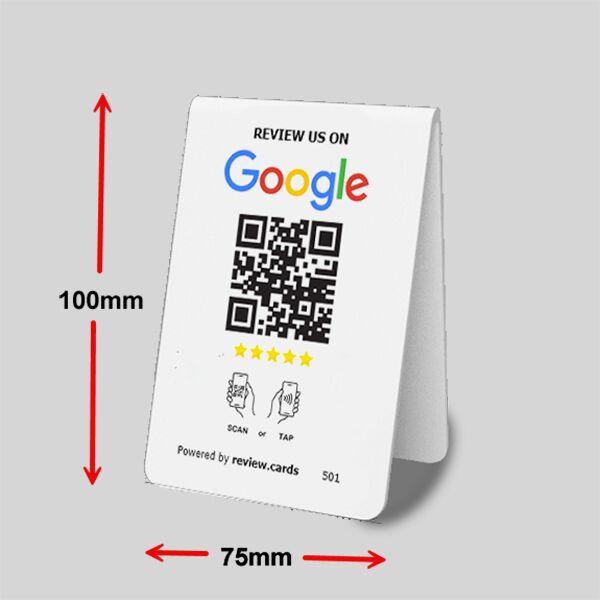 A white tabletop card (often referred to as Google Tap or Scan Table Tents) with a QR code for Google reviews. It includes instructions to scan or tap, and features a 5-star rating. The dimensions are marked as 100mm in height and 75mm in width. Text at the bottom reads "Powered by review.cards" and a small "501" is visible.