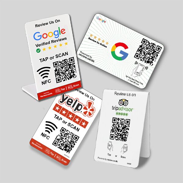 Four tabletop signs showcasing QR codes and logos for different review platforms. These Google Tap or Scan Table Tents encourage users to leave reviews on Google, Yelp, and TripAdvisor with instructions to scan the QR codes or tap for NFC options, complete with relevant connectivity icons.